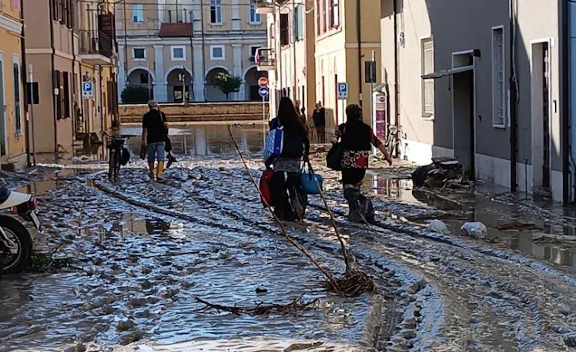 Flood in Italy kills 10 people as survivors are plucked from rooftops and trees